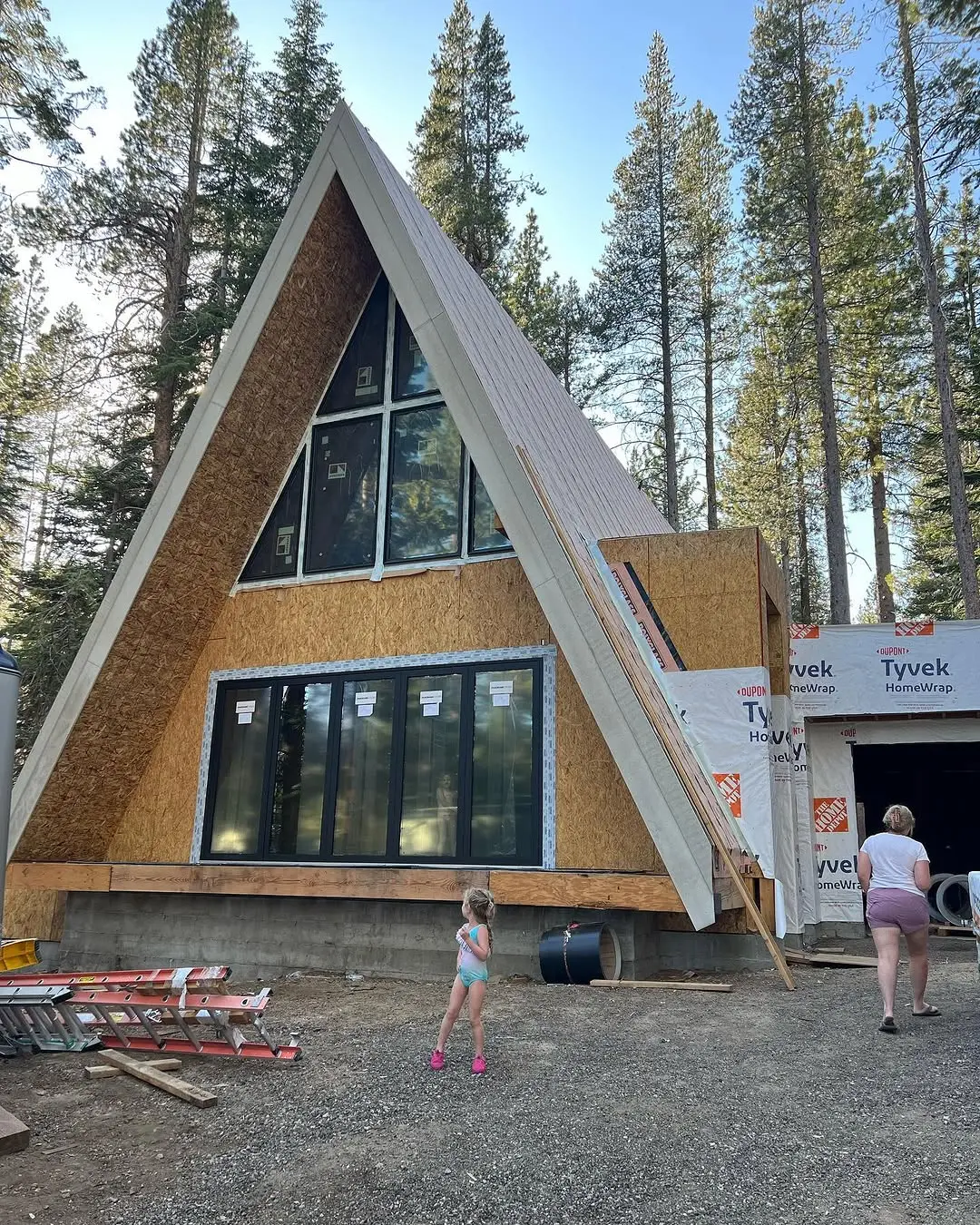 Modern A-Frame Collection Exterior Under Construction — Dramatic Roofline and Panoramic Glass Gable
