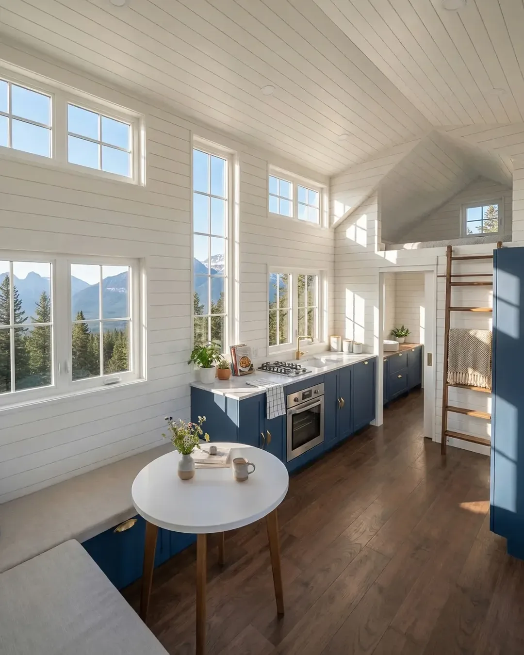 Luxury tiny home kitchen with blue shaker cabinets and panoramic windows — McLennan County build