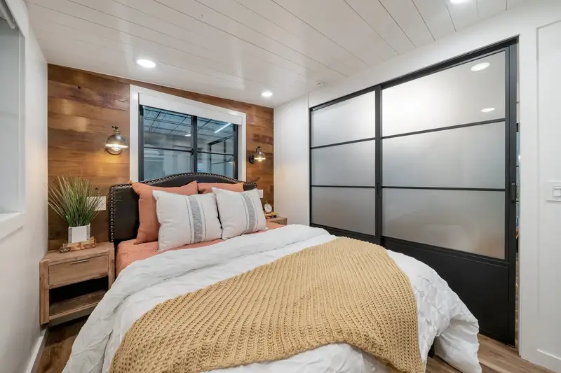 Lofted Master Bedroom — Wood Accent Wall & Frosted Glass