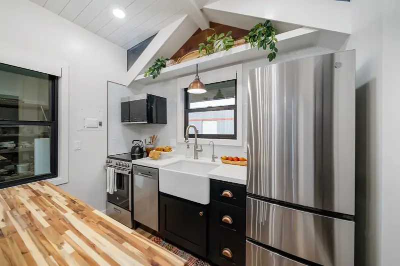 Gourmet Kitchen — Farm Sink, Copper Pendant & Stainless Fridge