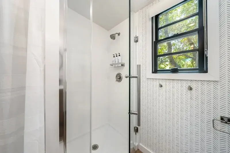 Walk-In Glass Shower with Herringbone Tile