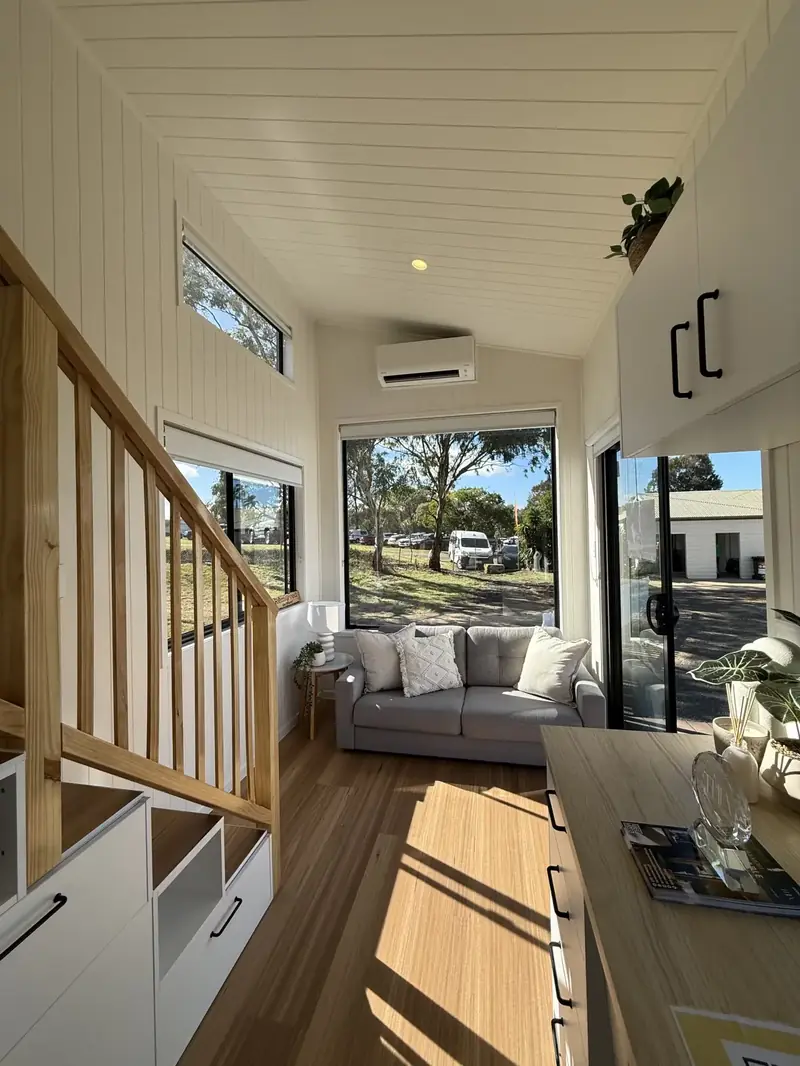 Luxury Prefab A-Frame Living Room with Designer Floating Wood Stove