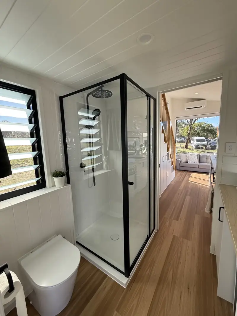 Luxury Tiny House Bathroom with Bespoke Dark Stone Walk In Rainfall Shower