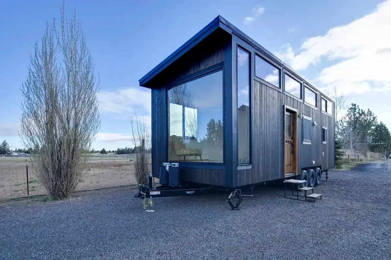 Aura Tiny Homes Warm Teak and Midnight Accent Luxury Modular Villa Exterior