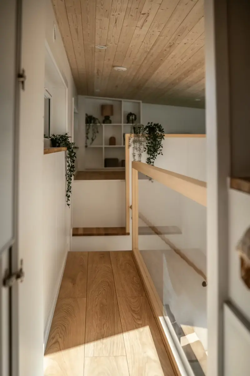 Modern Modular Home Upper Level Primary Loft Bedroom Layout with Glass Railing