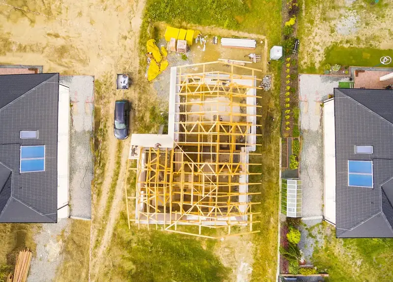 Aura Tiny Homes Delivery Infrastructure – Aerial View of Modular Home Freight Logistics, Flatbed Crane Deployment & Foundation Anchoring, Texas to Nationwide