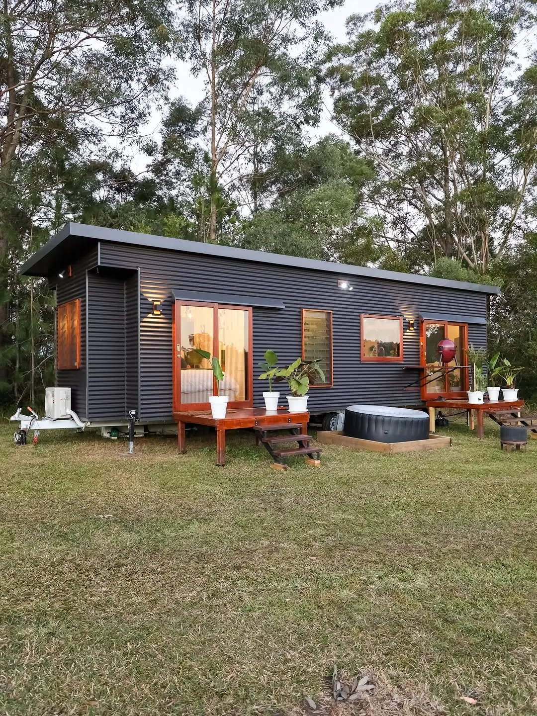 Aura Tiny Homes Minimalist Villa Collection Dark Cladding Exterior with Cedar Deck